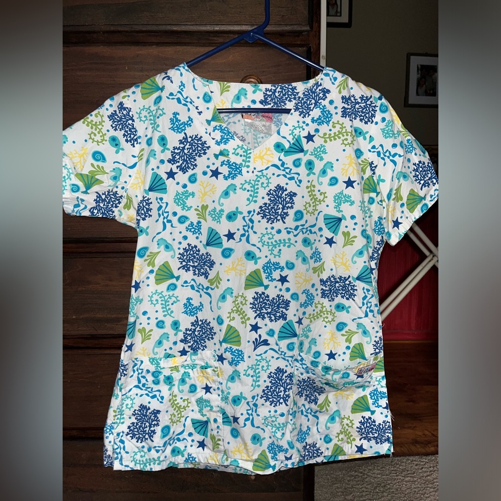 Sea creature patterned scrub top, size medium, loose fitting